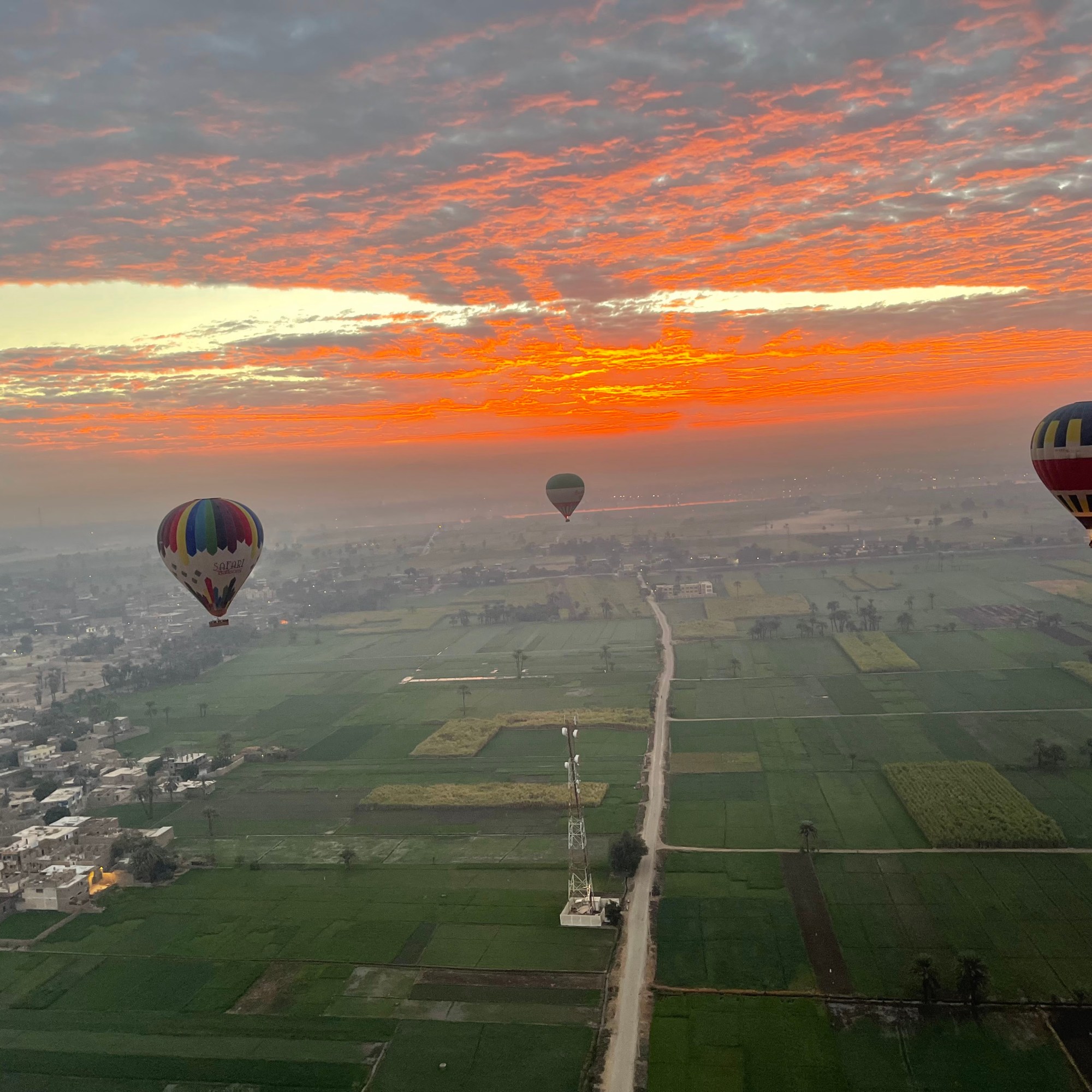 alt="hot air balloon ride at sunrise in Luxor"